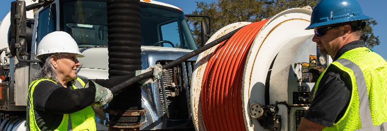 IM768x260 Two Utility Works with Vacuum Truck